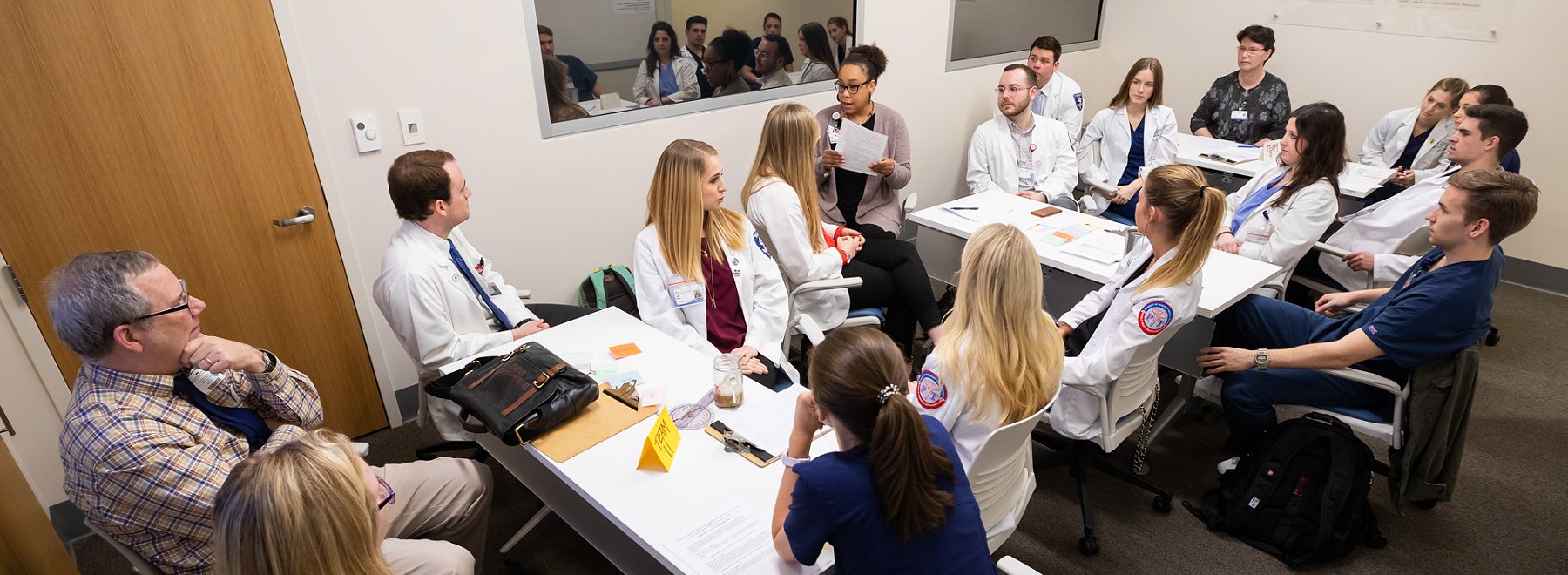 Students collaborate in conference room